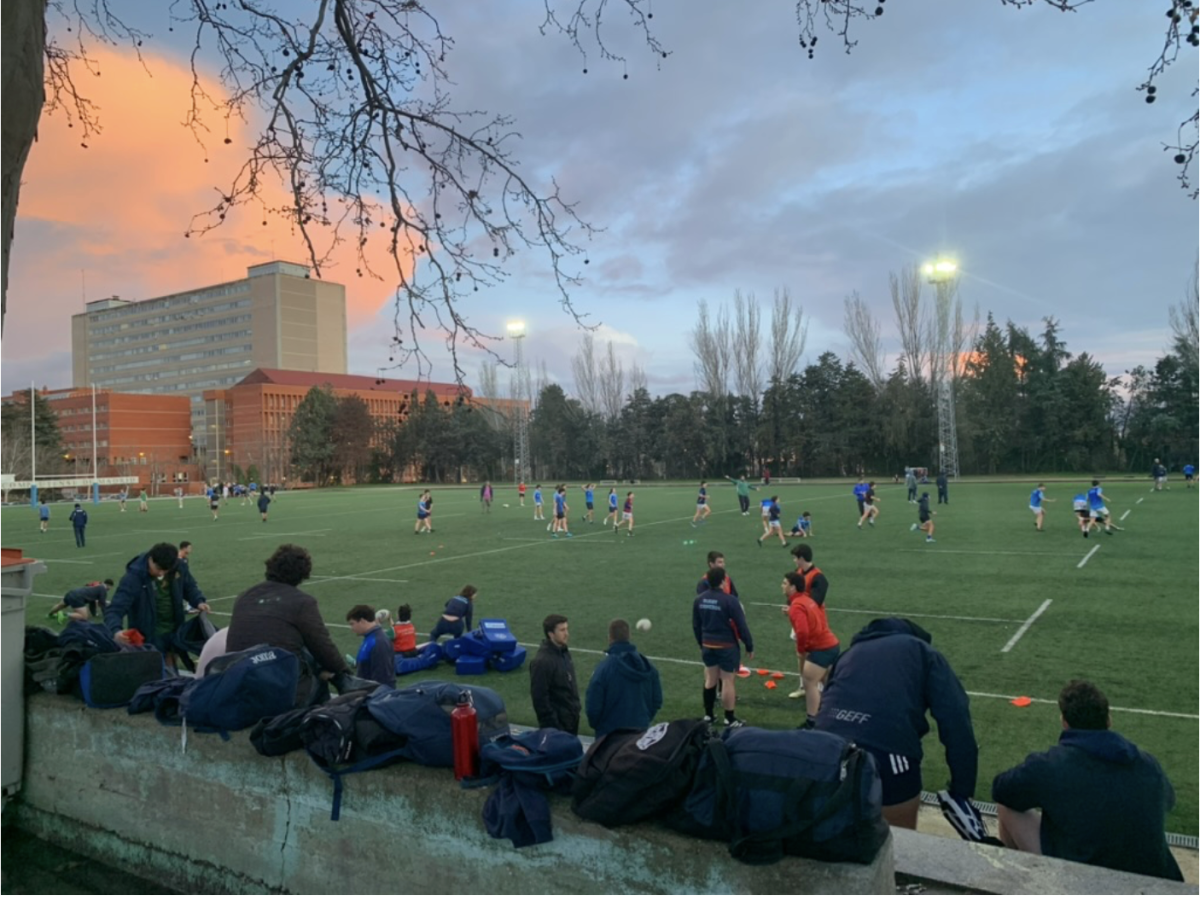 Players arrive for mid-week rugby practice on the field at the Universidad Complutense, near Moncloa.